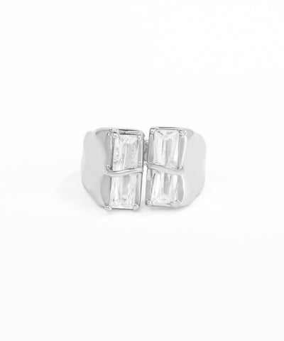 Silver ring with baguette-cut gemstones on a white background