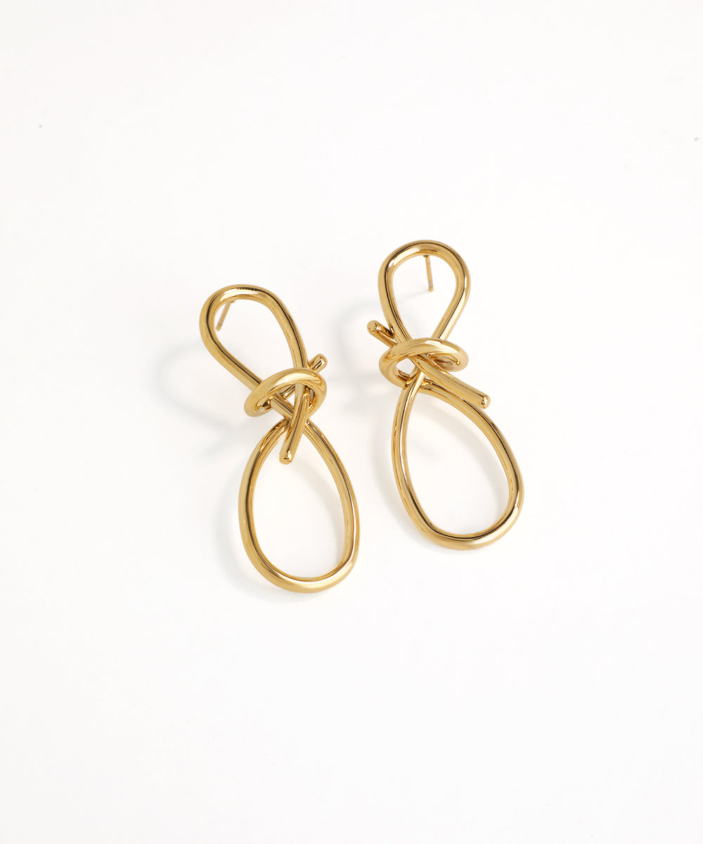 Gold earrings on a white background