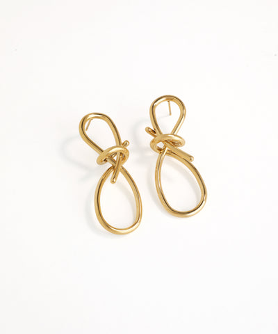 Gold earrings on a white background