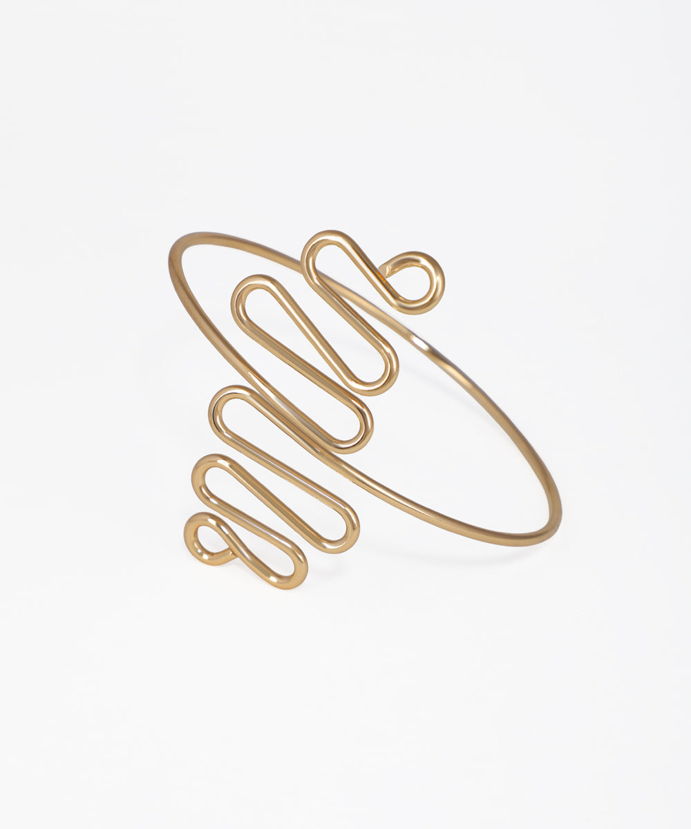 Gold-tone arm cuff with abstract wavy sculptural design