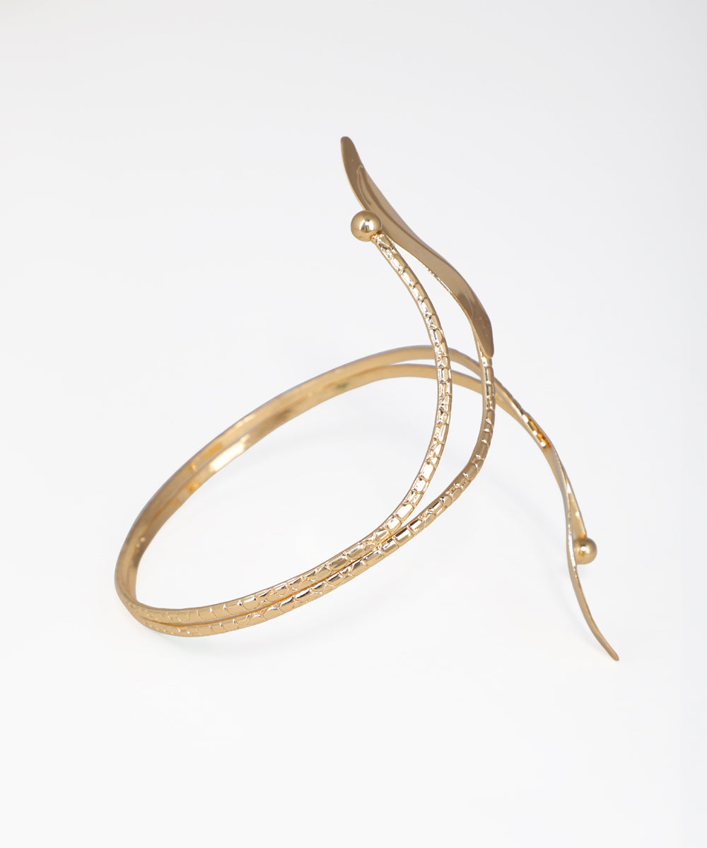 Gold bracelet on a white background