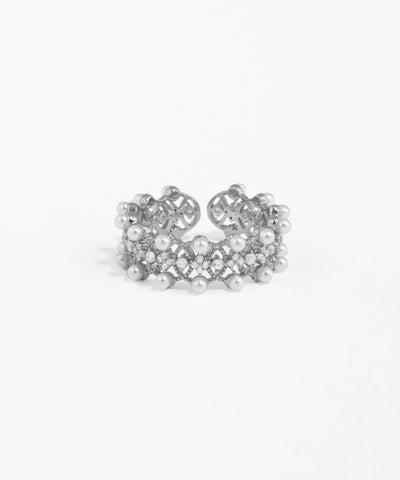 Silver ring with pearls on a white background
