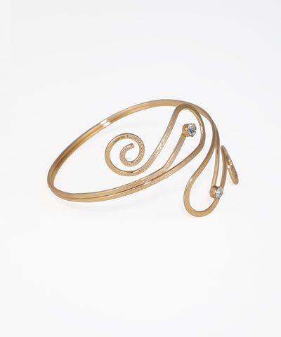 Gold spiral bracelet on a white background