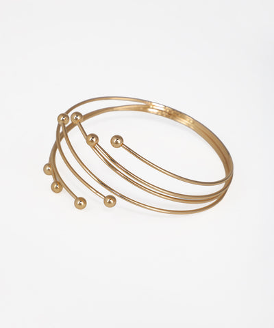 Gold-tone arm cuff with multiple bands and sphere accents