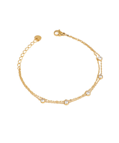 Gold-tone double chain bracelet with small round bezel-set CZ stones and lobster clasp closure