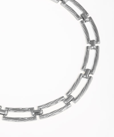 Silver chain necklace on a white background