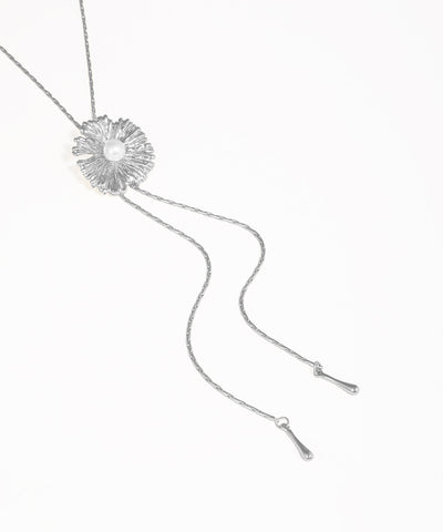 Silver necklace with a floral pendant on a white background
