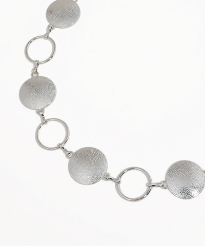 Silver necklace with circular links on a white background