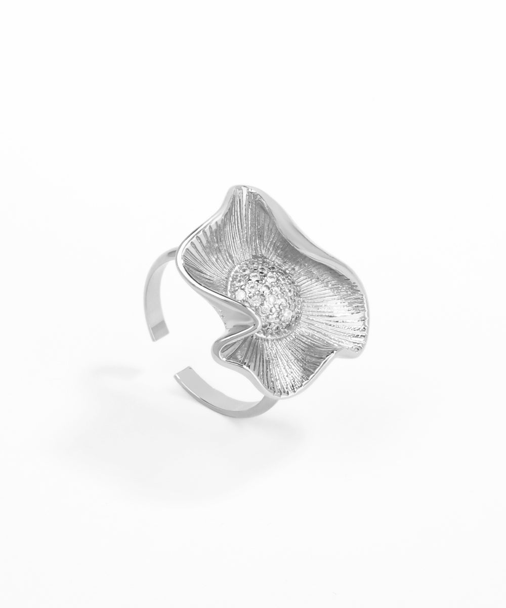 Silver ring with a diamond on a white background
