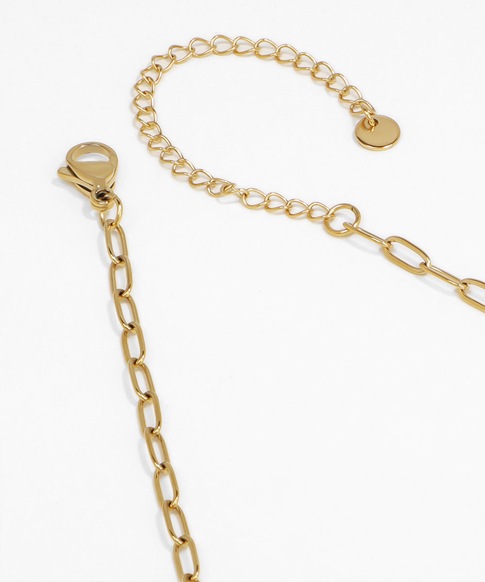 Gold chain bracelet on a white background