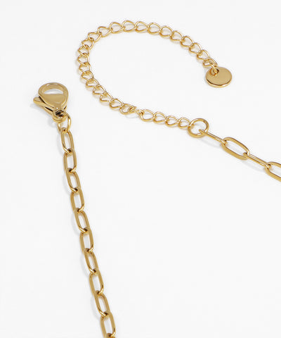 Gold chain bracelet on a white background