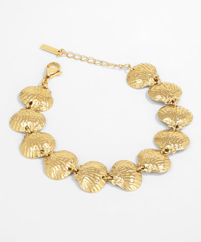 Gold bracelet with shell-like links on a white background