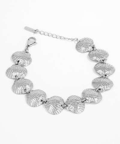 Silver shell bracelet on a white background