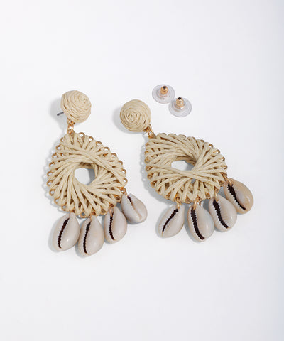 Gold-tone drop earrings with natural woven texture and dangling cowrie shells