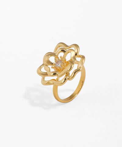 Gold-tone ring with openwork floral design and a single clear CZ stone in the center