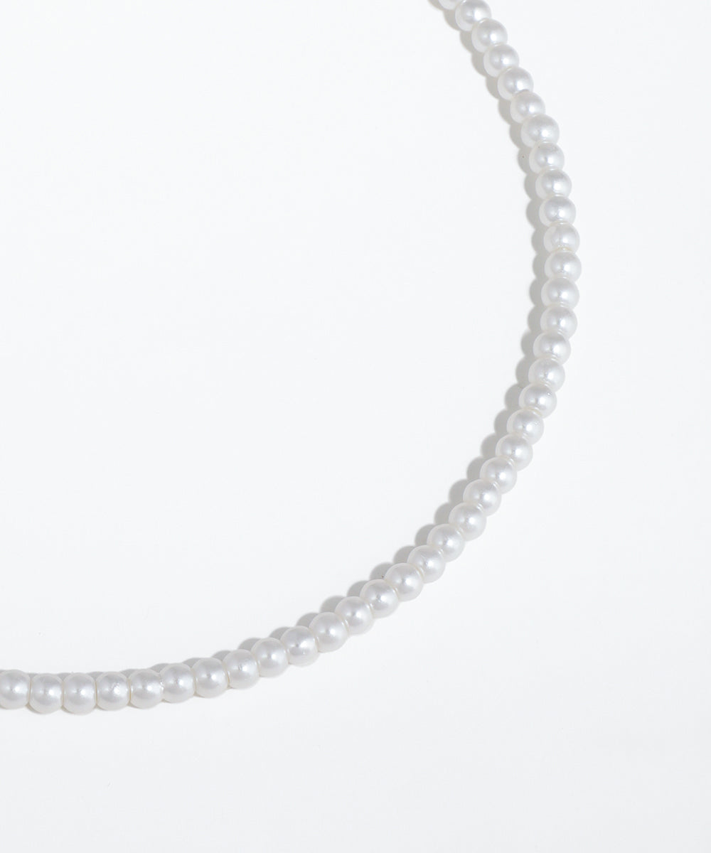 Pearl necklace on a white background