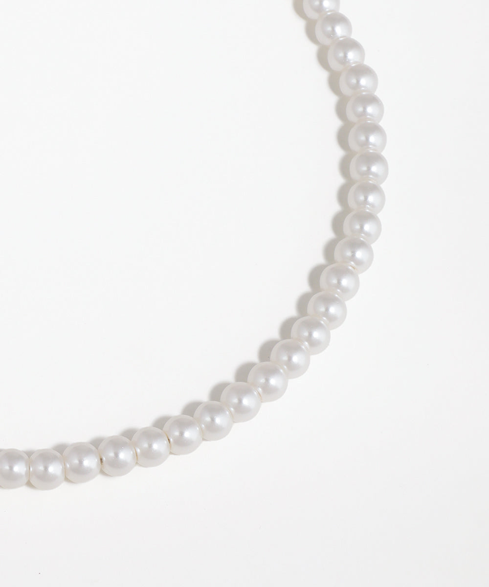 Pearl necklace on a white background