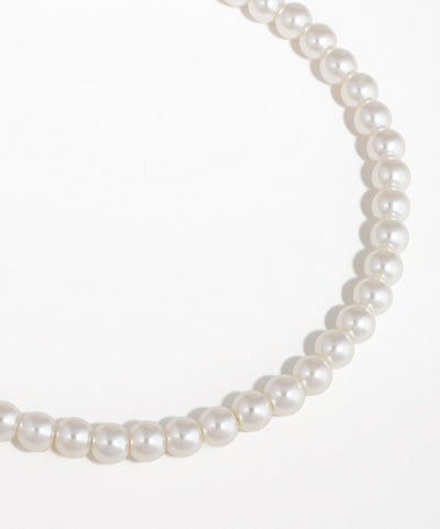 Pearl necklace on a white background