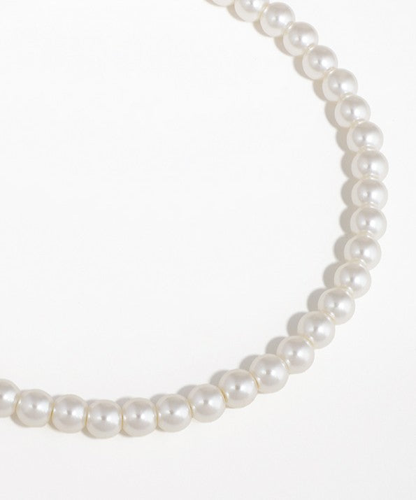 Pearl necklace on a white background