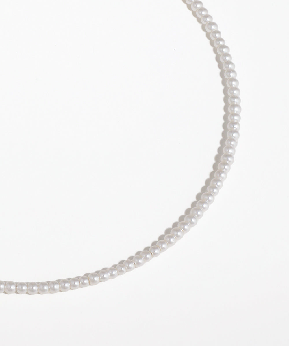 Pearl necklace on a white background