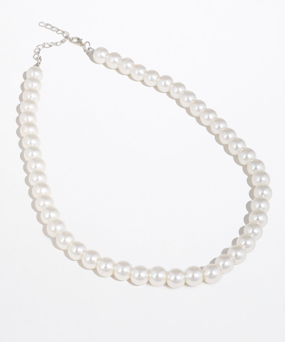 Silver-tone necklace with a single strand of white faux pearls