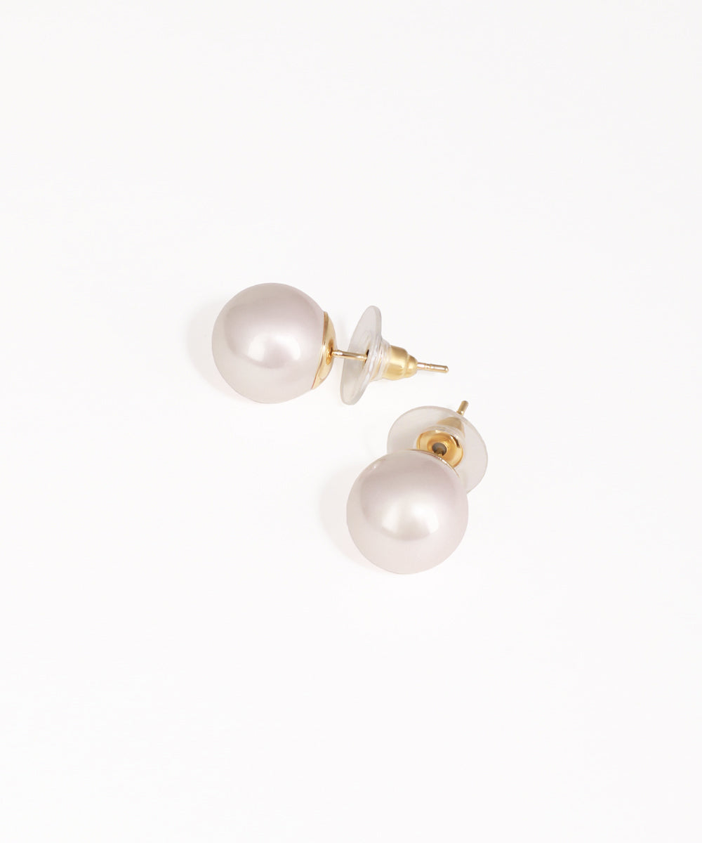 Pearl earrings with gold posts on a white background