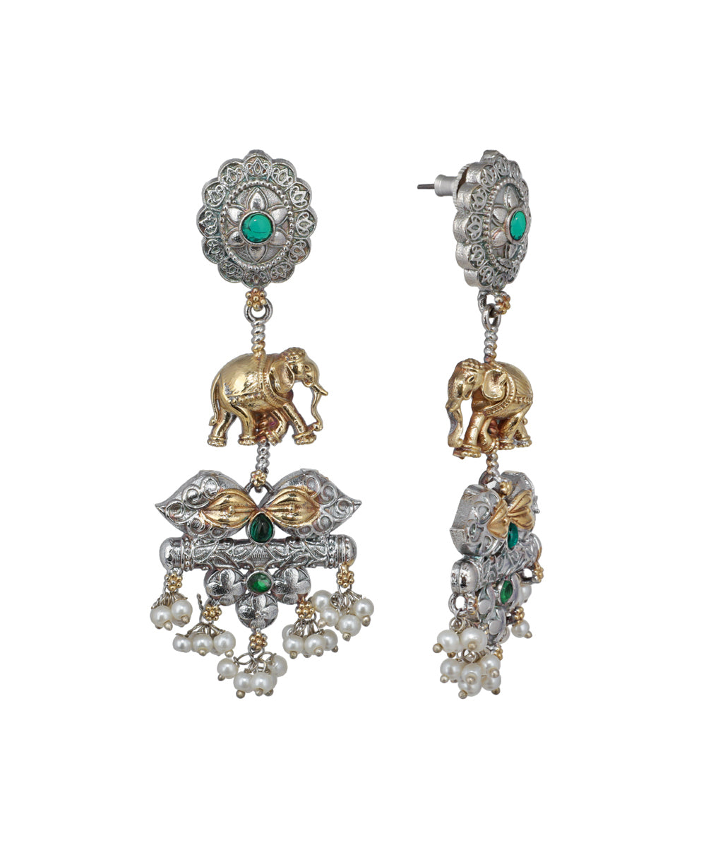 Ornate earrings with elephants, pearls, and gemstones on a white background