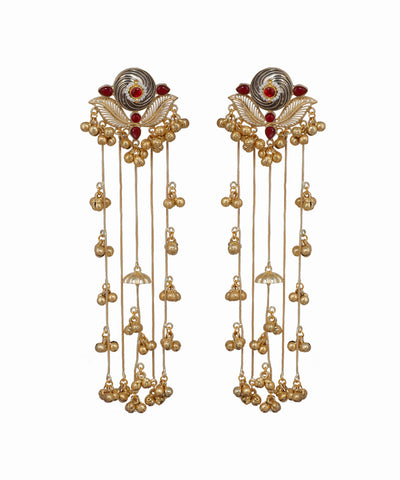 Pair of gold earrings with red gemstones on a white background