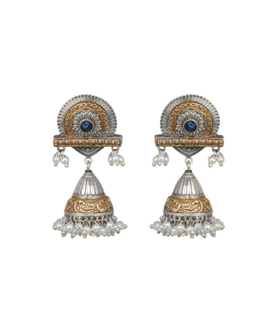 Pair of ornate earrings with gold and silver design on a white background