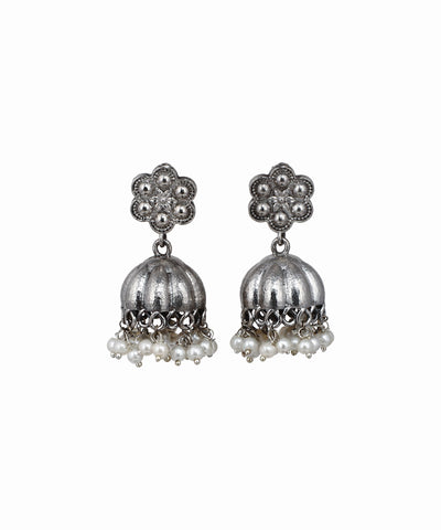 Pair of silver jhumka earrings with pearl drops on a white background
