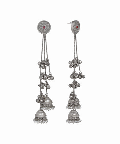 Pair of silver earrings with dangling components on a white background