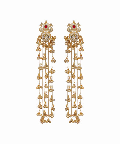 Pair of gold earrings with red gemstones on a white background