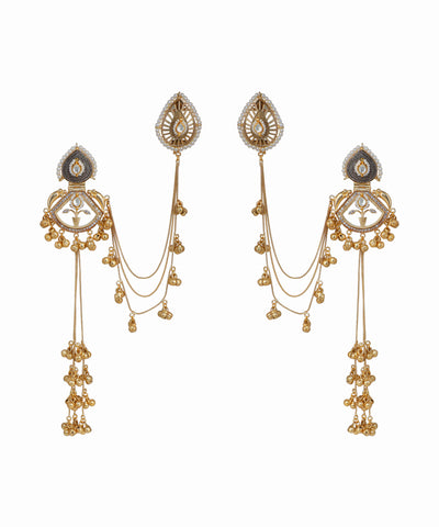 Pair of gold earrings with intricate designs on a white background
