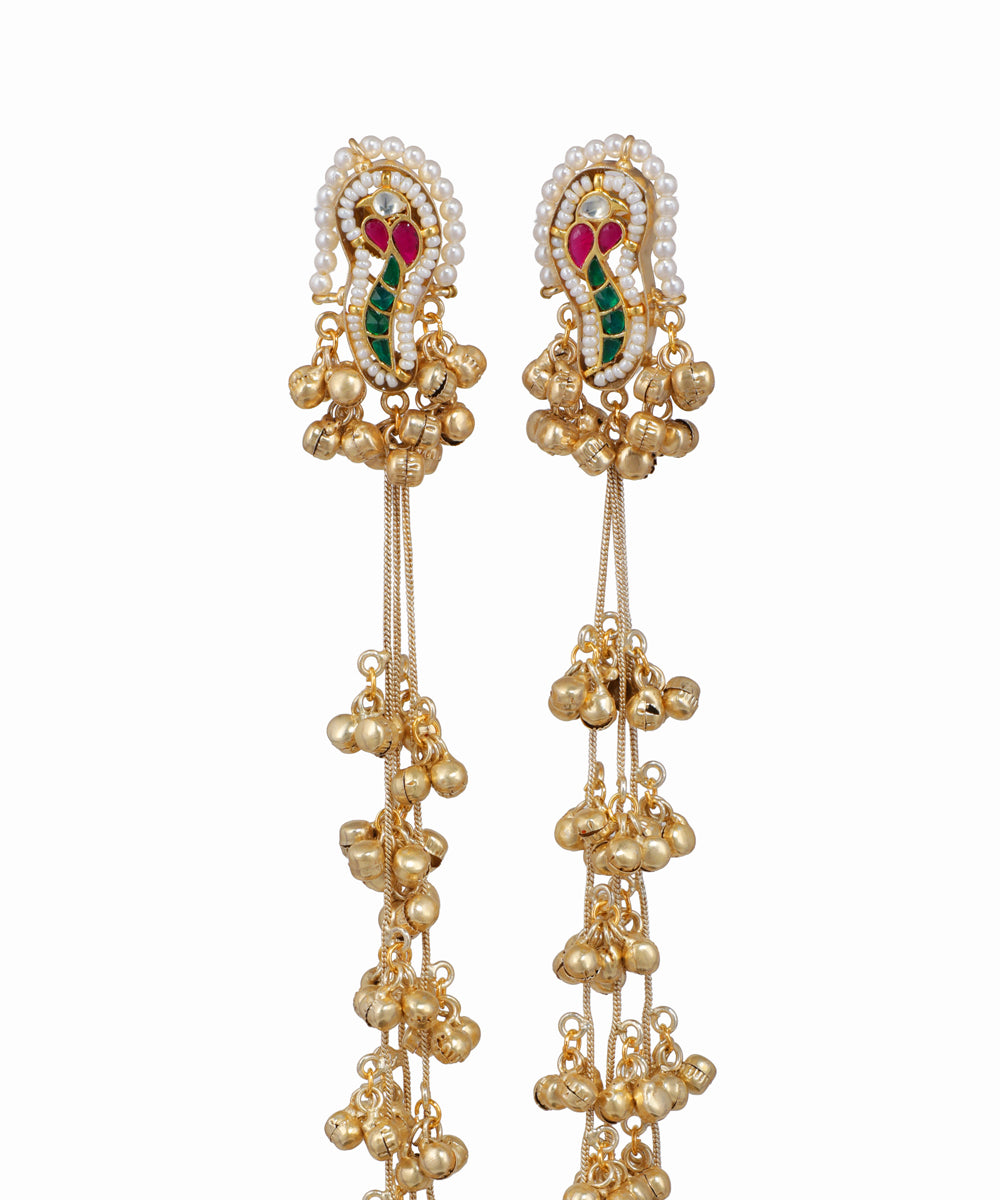 Pair of gold earrings with gemstones on a white background