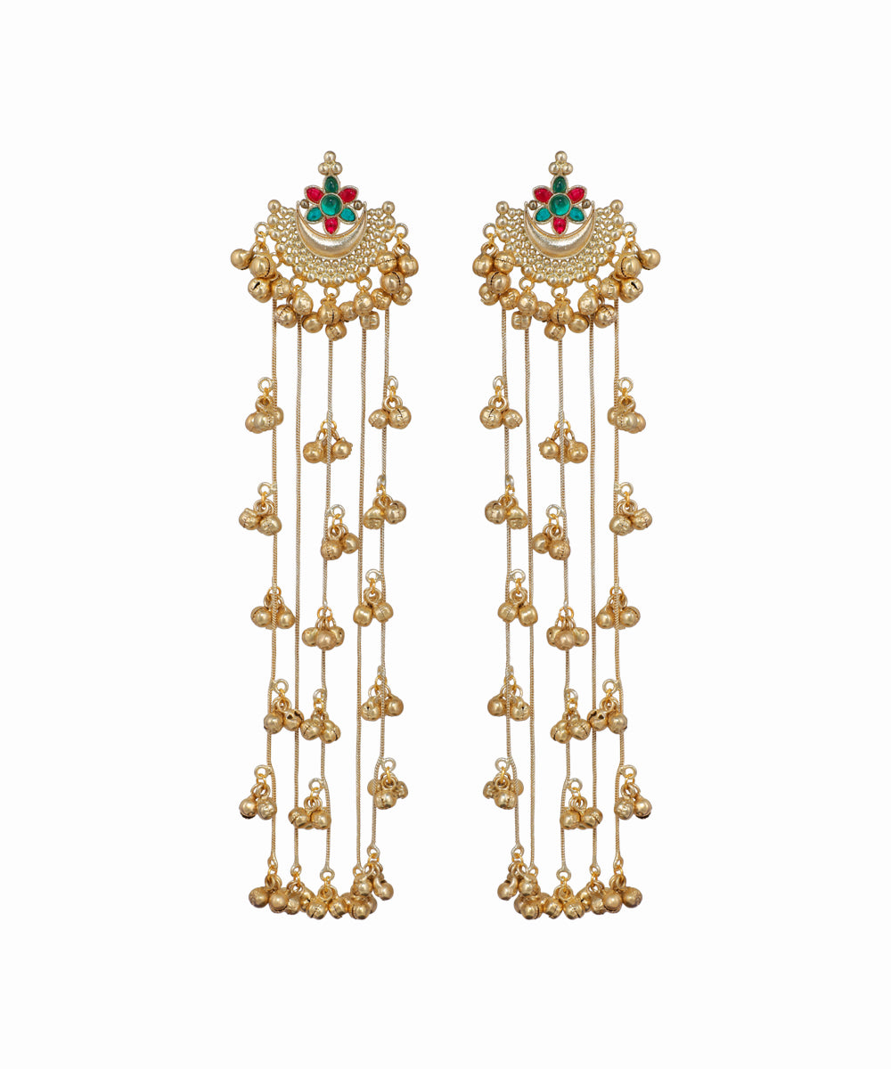 Pair of gold earrings with intricate designs on a white background