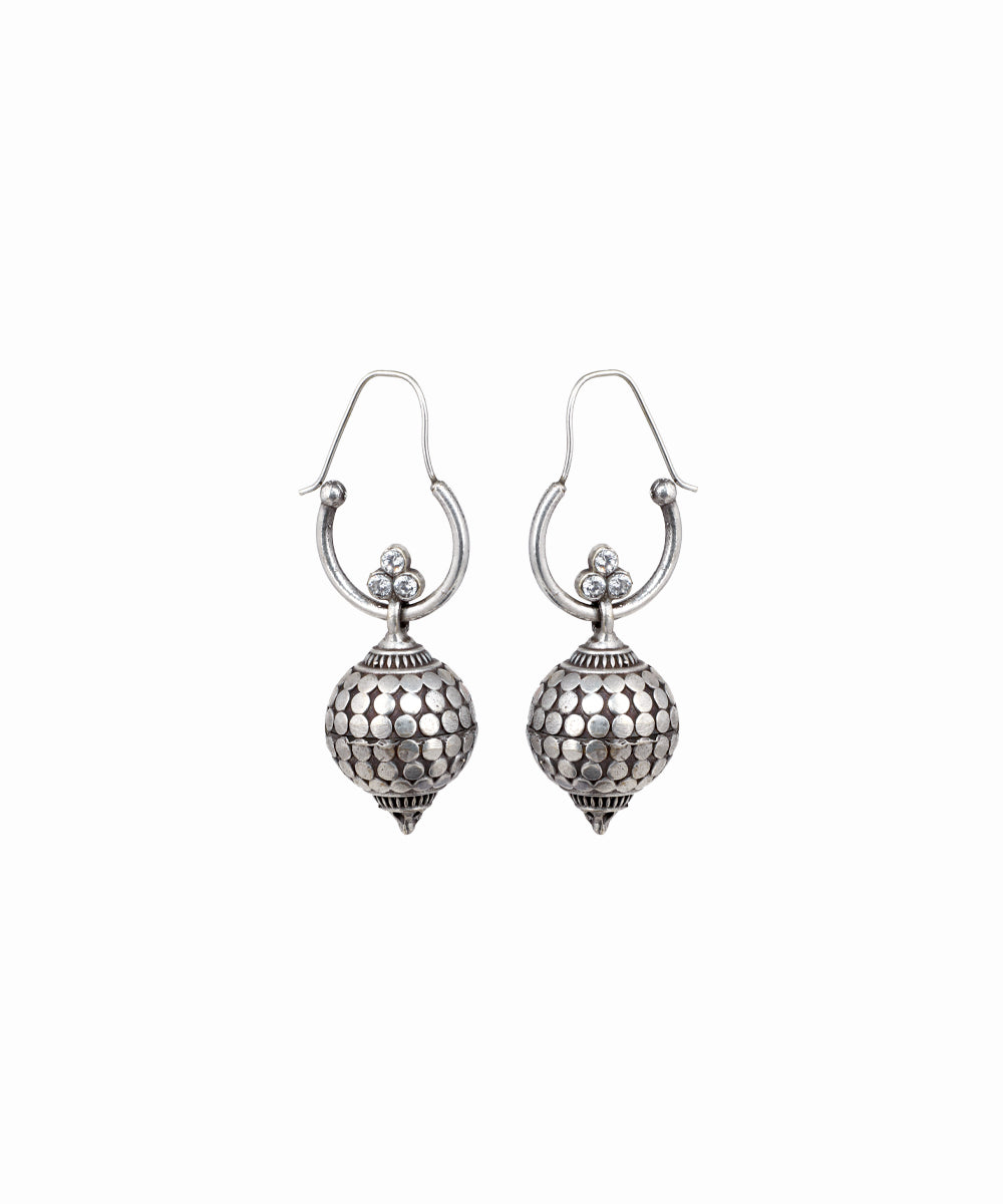 Pair of silver earrings on a white background