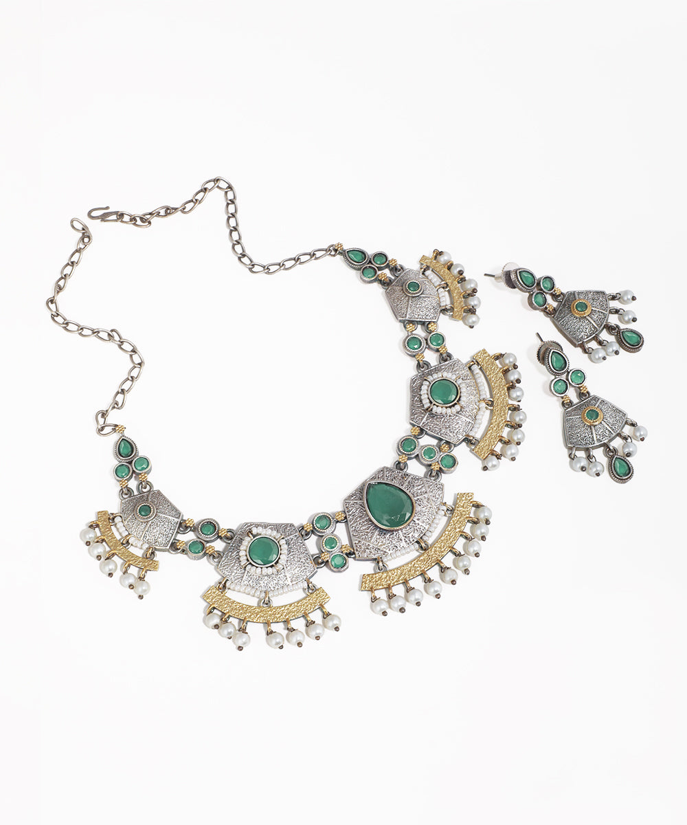 Oxidised silver-tone necklace set with green glass stones, gold-tone accents, and faux pearl drops