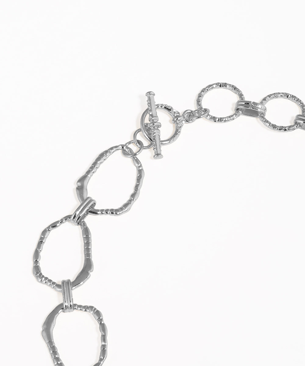 Silver chain bracelet on a white background