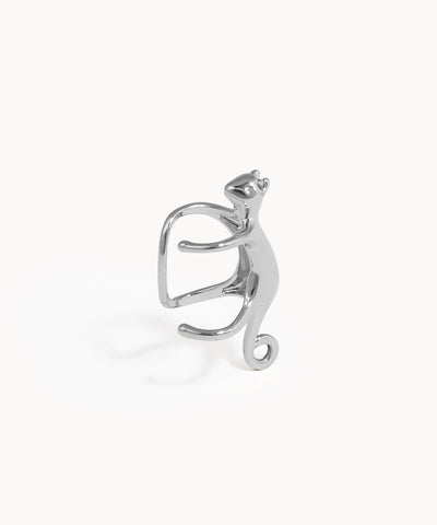 Silver cat-shaped earring on a white background