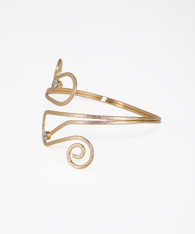 Gold bracelet with spiral design on a white background