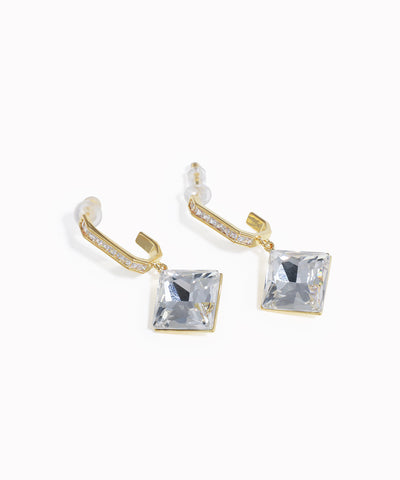 Gold-tone drop earrings with clear square stone and small channel-set accents
