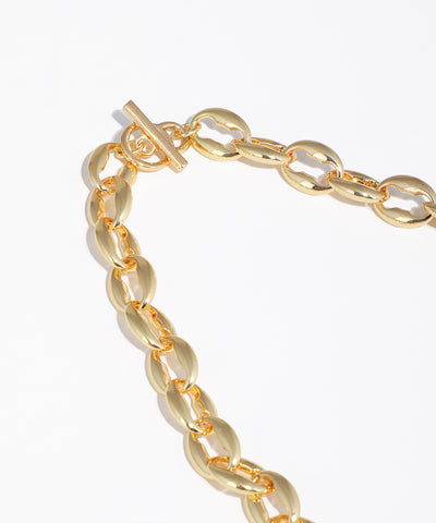 Gold chain bracelet on a white background
