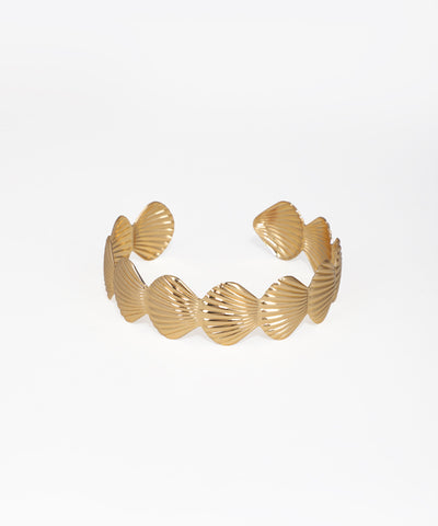 Gold bracelet with shell-like designs on a white background