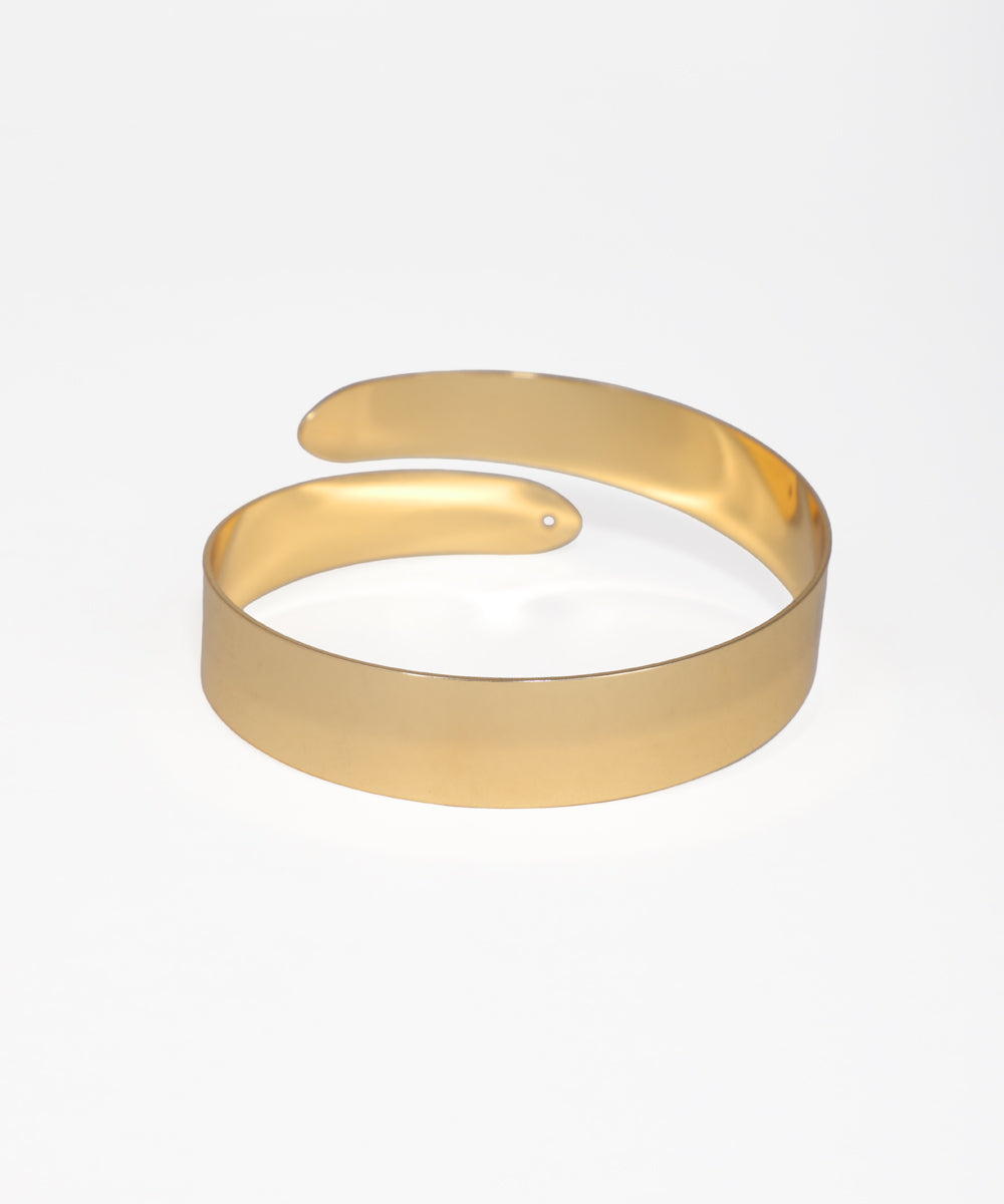 Gold bracelet on a white background