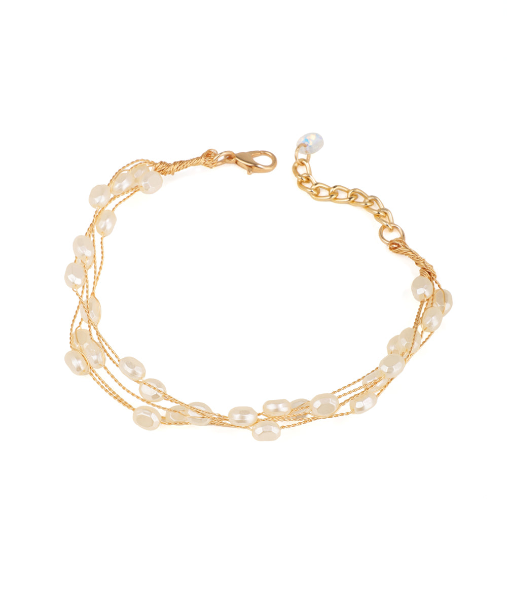 Gold-tone multi-strand bracelets with irregular faux pearls and a clear bead
