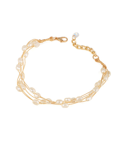 Gold-tone multi-strand bracelets with irregular faux pearls and a clear bead