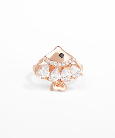 Rose gold ring with pear-shaped gemstones on a white background