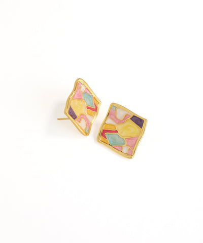 Colorful geometric earrings on a white background