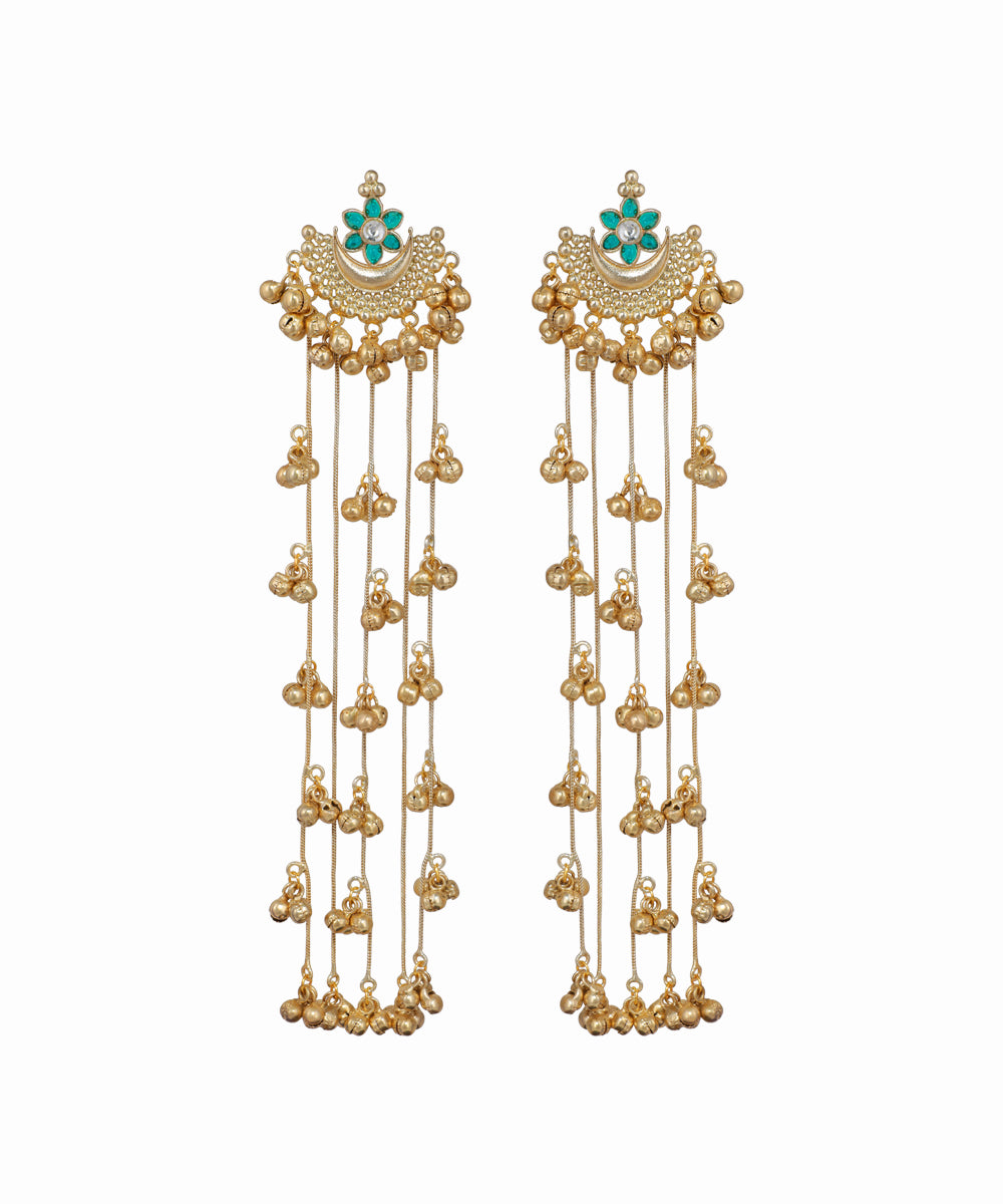 Gold earrings with turquoise stones on a white background