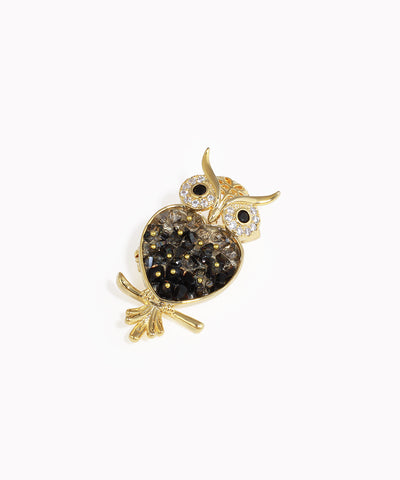 Gold-tone owl brooch with black and clear glass crystal body and CZ eyes